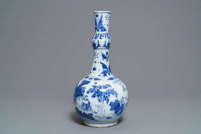 A Chinese blue and white bottle vase with figures in a landscape, Transitional period