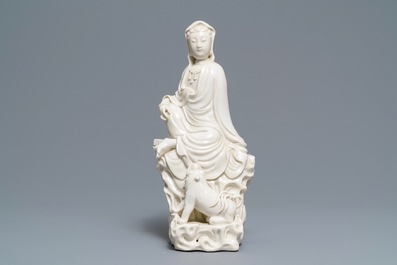 A Chinese Dehua blanc de Chine group of Guanyin with a tiger, 18/19th C.