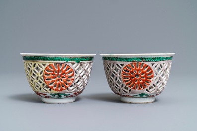 A pair of reticulated double-walled Chinese famille verte cups, Kangxi
