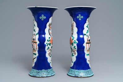 A pair of Chinese famille verte powder blue-ground gu vases, Kangxi mark, 19th C.