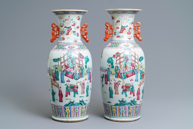 A pair of Chinese famille rose court scene vases, 19th C.