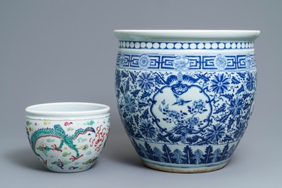 A Chinese blue and white fish bowl and a famille rose 'dragon' jardini&egrave;re, 19th C. and Yongzheng