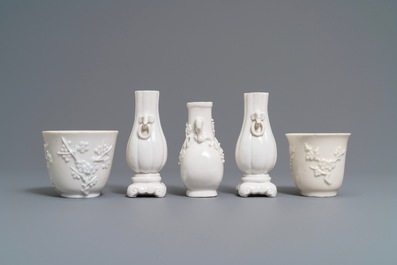 Three Chinese blanc de Chine vases and two cups with applied designs, Kangxi and later