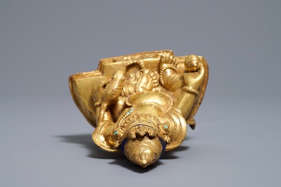 A Sino-Tibetan gilt bronze figure of Jambhala, 19/20th C.