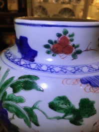 A Chinese wucai baluster vase and cover with playing boys, Transitional period