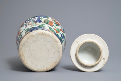 A Chinese wucai baluster vase and cover with playing boys, Transitional period