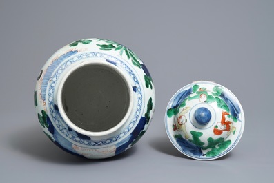 A Chinese wucai baluster vase and cover with playing boys, Transitional period
