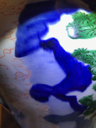 A Chinese wucai baluster vase and cover with playing boys, Transitional period
