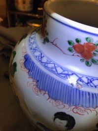 A Chinese wucai baluster vase and cover with playing boys, Transitional period