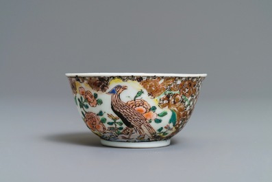 A Chinese famille rose 'pheasant' cup and saucer, Yongzheng