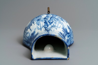 A Dutch Delft blue and white 'putti fountain' wall cistern, 18th C.