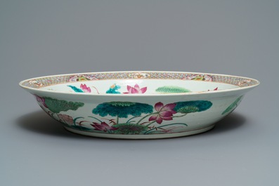 A massive Chinese famille rose 'ducks in a lotus pond' charger, Qianlong mark, 19th C.