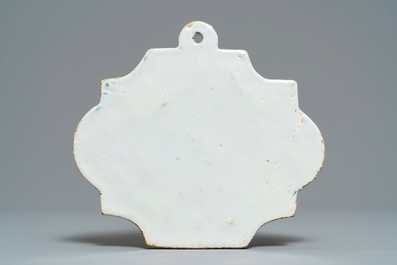 A Dutch Delft blue and white plaque with a lady in a landscape, 18th C.