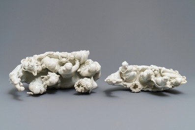 Two Chinese Dehua blanc de Chine groups with immortals on log boats, 19th C.