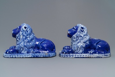 A pair of blue-ground models of recumbent lions, Saint-Omer, France, late 18th C.