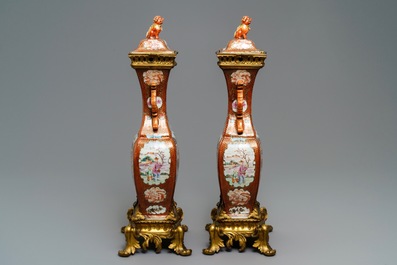 A pair of large Chinese ormolu-mounted famille rose 'mandarin' vases and covers, Qianlong