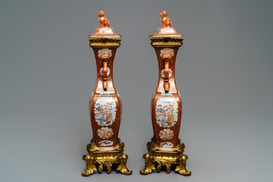A pair of large Chinese ormolu-mounted famille rose 'mandarin' vases and covers, Qianlong