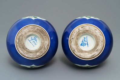 A pair of Chinese famille verte powder blue-ground bottle vases, 19th C.