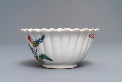 A Japanese Kakiemon fluted bowl and a small plate, Edo, 18th C.