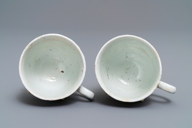 A pair of Chinese famille rose 'rooster' cups and saucers with applied floral designs, Yongzheng