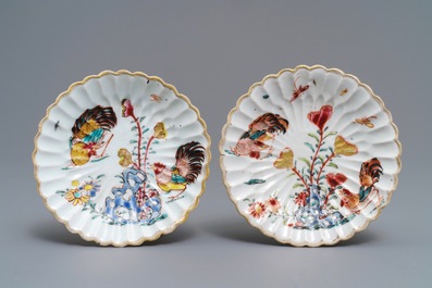 A pair of Chinese famille rose 'rooster' cups and saucers with applied floral designs, Yongzheng