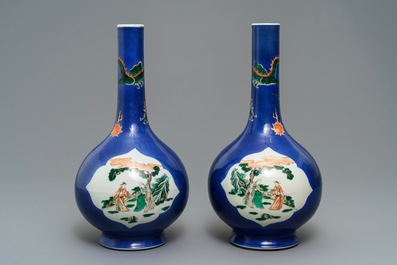 A pair of Chinese famille verte powder blue-ground bottle vases, 19th C.