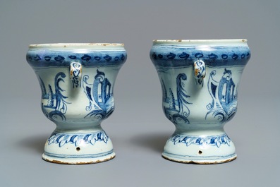 A pair of small Dutch Delft blue and white 'campana' vases on stands, 18th C.