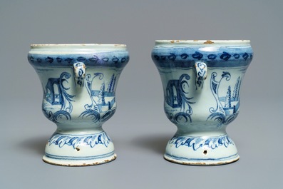 A pair of small Dutch Delft blue and white 'campana' vases on stands, 18th C.