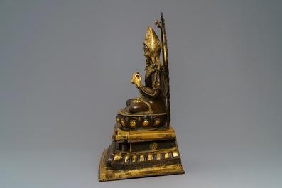 A massive parcel-gilt bronze figure of the seated Tsongkhapa, China or Tibet, 19/20th C.