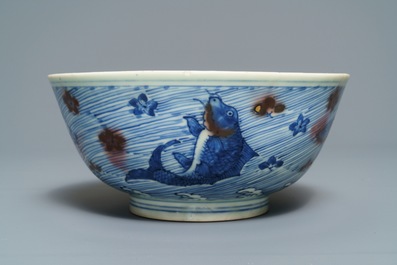 A Chinese blue and underglaze red bowl with carps and marine animals, Xuande mark, Kangxi