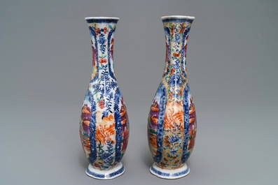 A pair of Chinese famille rose 'mandarin' vases, Qianlong