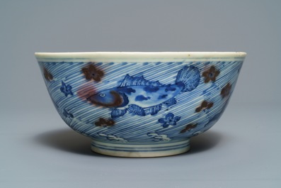 A Chinese blue and underglaze red bowl with carps and marine animals, Xuande mark, Kangxi
