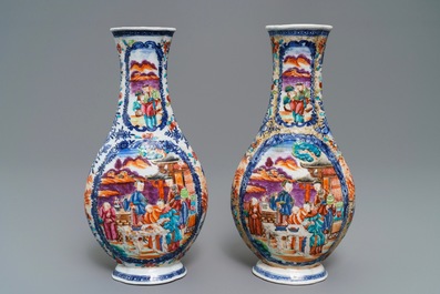 A pair of Chinese famille rose 'mandarin' vases, Qianlong