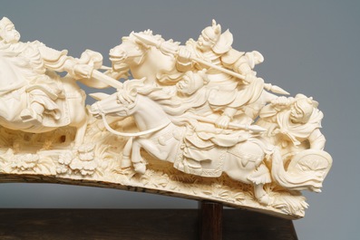 A Chinese carved ivory group with warriors on horseback, 2nd quarter 20th C.