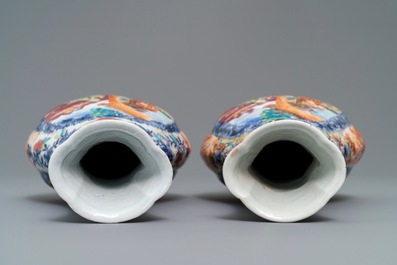 A pair of Chinese famille rose 'mandarin' vases, Qianlong