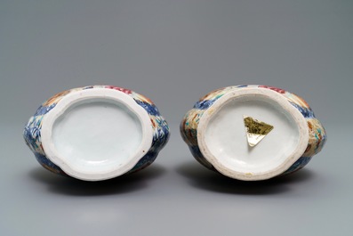 A pair of Chinese famille rose 'mandarin' vases, Qianlong