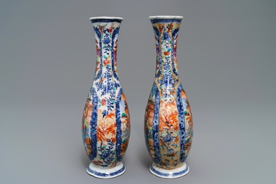 A pair of Chinese famille rose 'mandarin' vases, Qianlong