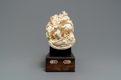 A Chinese carved ivory group with warriors on horseback, 2nd quarter 20th C.