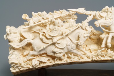 A Chinese carved ivory group with warriors on horseback, 2nd quarter 20th C.