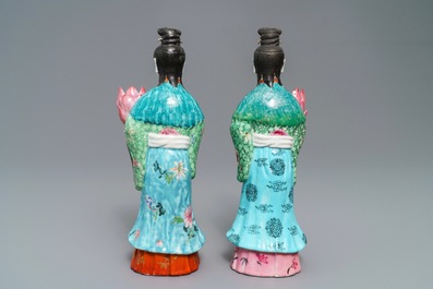 Two Chinese famille rose candle holders modelled as court ladies, Qianlong