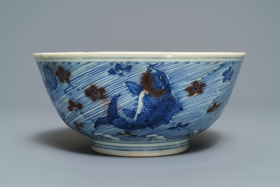 A Chinese blue and underglaze red bowl with carps and marine animals, Xuande mark, Kangxi