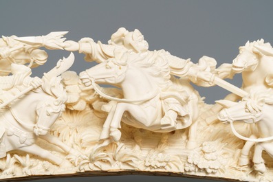A Chinese carved ivory group with warriors on horseback, 2nd quarter 20th C.