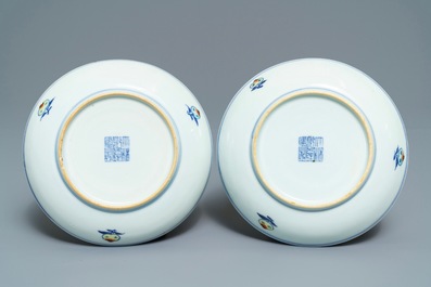 A pair of Chinese doucai plates with peaches, Qianlong mark, 19th C.
