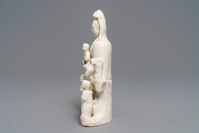 A Chinese Dehua blanc de Chine 'Guanyin with children 'group, Kangxi