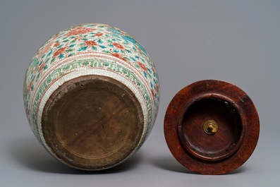 A Chinese polychrome Swatow jar with Buddhist lions among peony scrolls, Ming