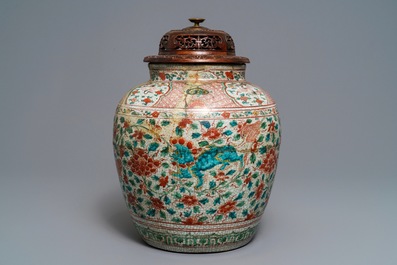 A Chinese polychrome Swatow jar with Buddhist lions among peony scrolls, Ming