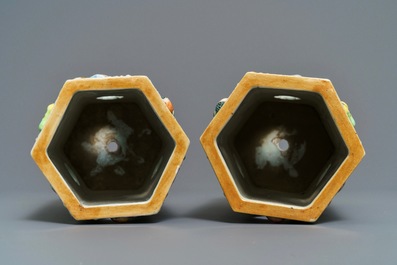 A pair of Chinese famille rose reticulated hat stands with applied designs, 19th C.