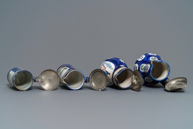 Four pewter-mounted Brussels faience jugs and a shaker, 18/19th C.