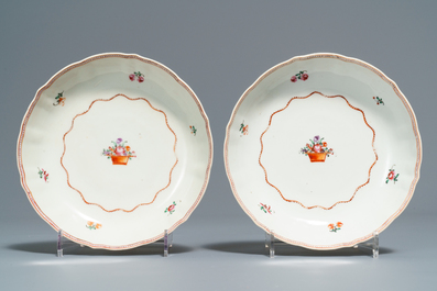 Two Chinese famille rose teapots and covers and two sets of cups and saucers, Qianlong