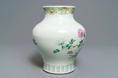 A Chinese famille rose vase with a bird on a flowering branch, 19th C.